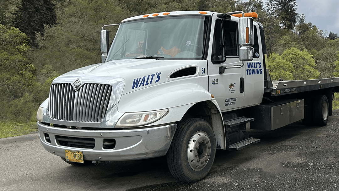 A Walt's Towing flatbed tow truck in Roseburg, OR